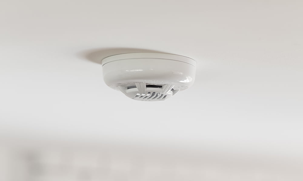 smoke-detector-mounted-white-ceiling